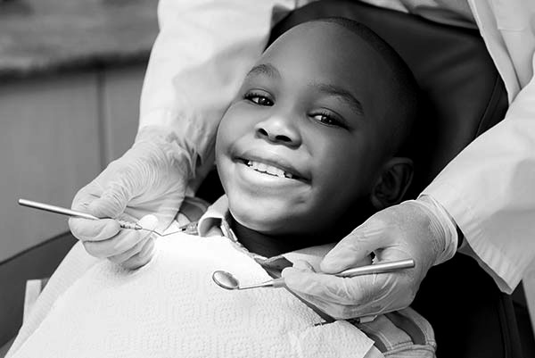 A young boy getting a dental checkup